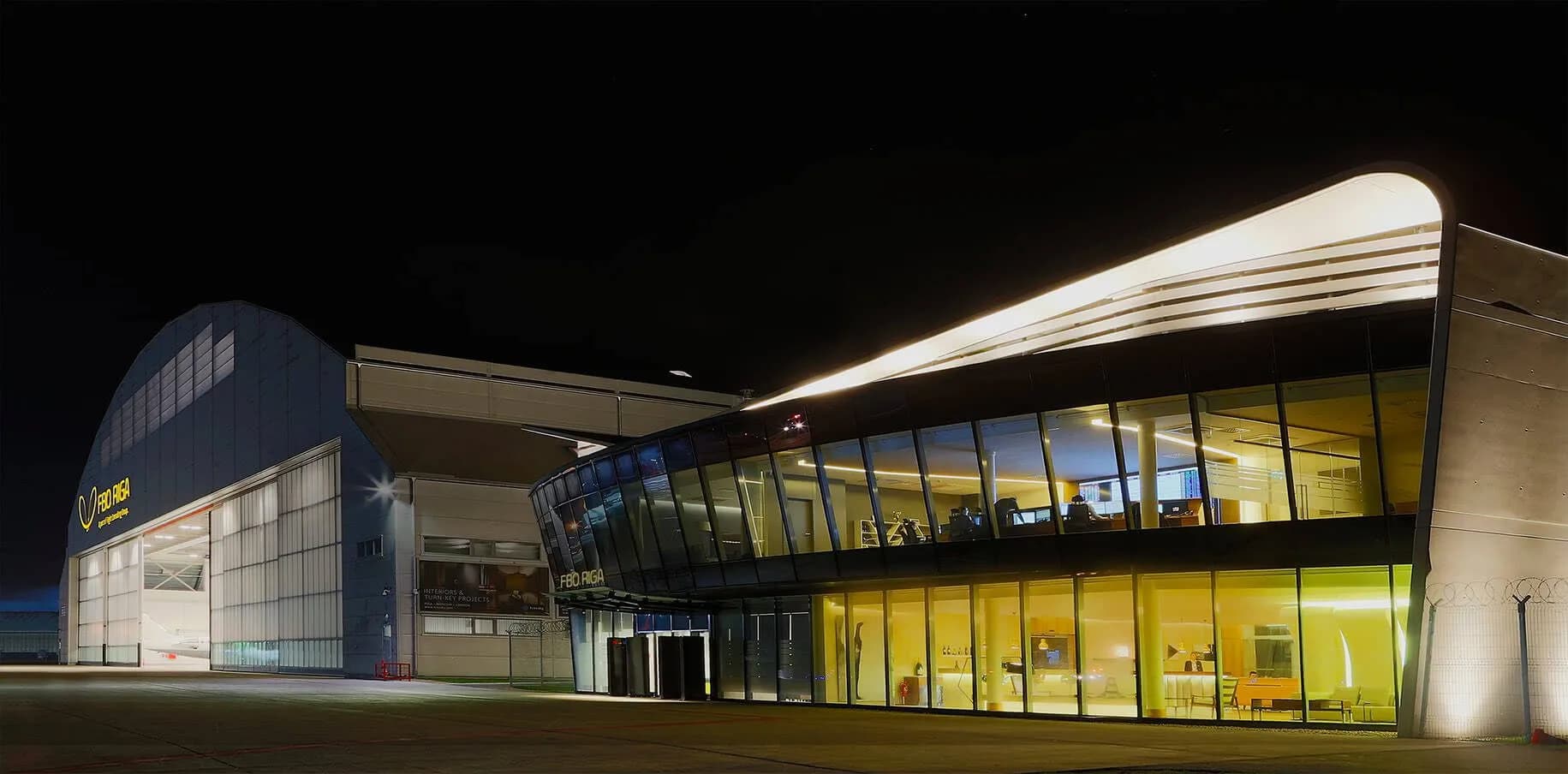 The FBO RIGA terminal and hangar at night